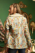 Load image into Gallery viewer, This statement Aratta Renaissance Silk Jacquard Blazer is a must-have! This unique blazer will be in style every season. Perfect for giving your look boss vibes, this feminine elegant blazer features a V neckline, floral Jacquard silk material and metallic gold trim around the collar and pockets. Also, the inside of the blazer has a stunning unique Francois Boucher&amp; Madame De Pompadour print satin lining. Giving you a relaxed fit and slightly cropped finish complete this must-have style. 
