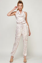 Load image into Gallery viewer, We&#39;re loving this jumpsuit the perfect &#39;gram-worthy fit. Whether you&#39;re looking to create a casual look or dress it up for a more work-friendly look, this piece has got you covered! This jumpsuit features soft satin material, halter, pockets, and elastic waistband drawstring. Pair this piece with a transparent high heel, gold accessories, and a handbag for an outfit you will love! 
