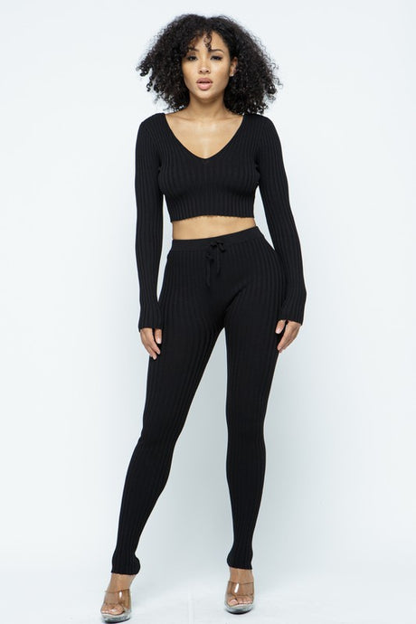 This Just Chill Set is every wardrobe essential. Featuring a black rib kitted fabric with a V neckline top with long sleeves, high rise pants with soft elasticized waistband, lightweight material. Style with a high heel or boots and handbag for a weekend look you'll love! 