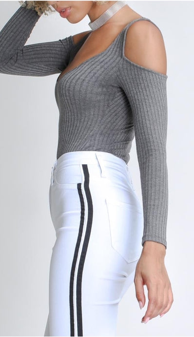 Flex your style in these cute white skinny Jeans with a contrast black stripe designs. Perfect for styling any and every way you want! These jeans come in a high rise fit featuring a raw uneven hem ends, zip and button closure. Pair with a graphic tee or chic fashion top, high heels or combat boots and of course a handbag for a complete look!