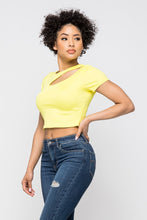 Load image into Gallery viewer, Crop tops are essential in every girls wardrobe and we&#39;re obsessing over our vibrant yellow crop top. Featuring a stretch kitted material with short sleeves and a round neckline, and a cut-out detailing which exposes the skin for a real statement-making look. Pair with your favorite blue wash denim jeans or with cargos and high heels to complete the look
