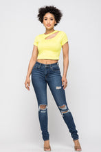 Load image into Gallery viewer, Crop tops are essential in every girls wardrobe and we&#39;re obsessing over our vibrant yellow crop top. Featuring a stretch kitted material with short sleeves and a round neckline, and a cut-out detailing which exposes the skin for a real statement-making look. Pair with your favorite blue wash denim jeans or with cargos and high heels to complete the look
